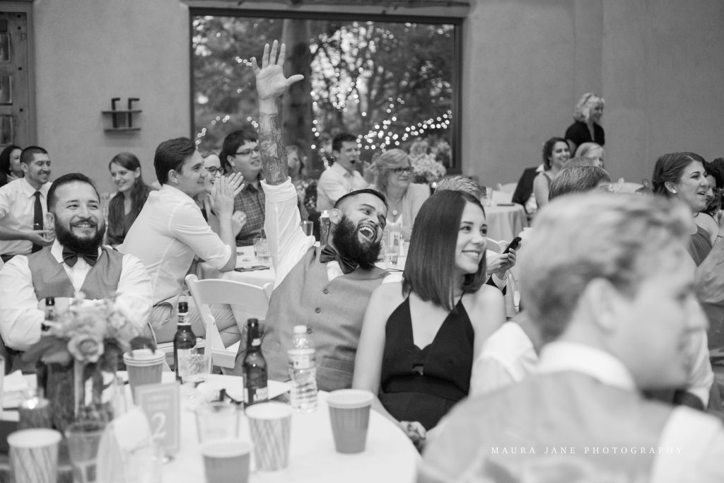 Wedding party celebrating during wedding reception